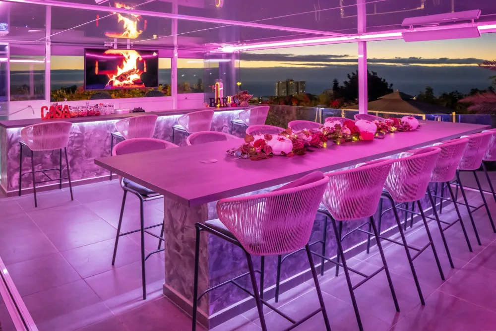 The sunset bar at Casa Amore party villa in Costa Adeje, Tenerife, lit up for an evening celebration