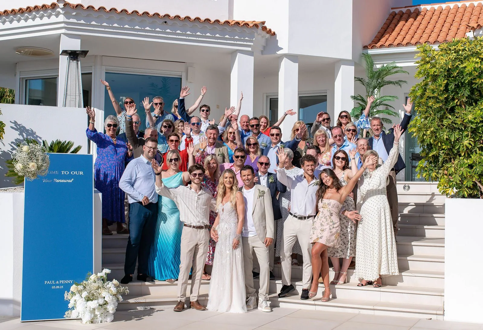 Wedding guests celebrating on the front steps of Casa Amore Tenerife